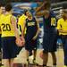 Michigan sophomore Trey Burke smiles as he huddles with teammates during an open practice at the Georgia Dome in Atlanta on Friday, April 5, 2015. Melanie Maxwell I AnnArbor.com